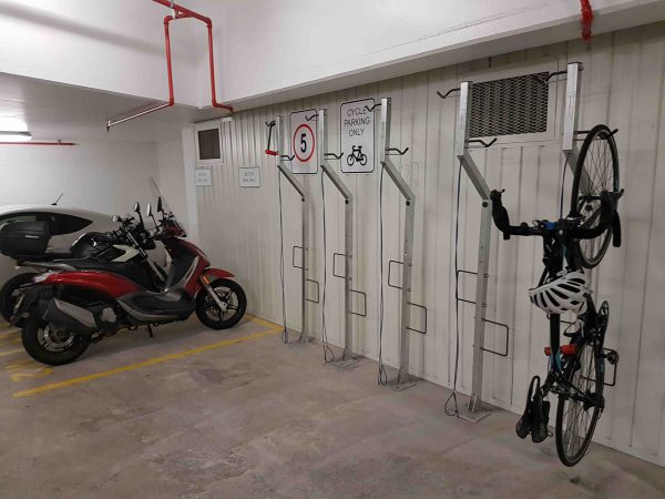 Vertical compact free standing bicycle rack